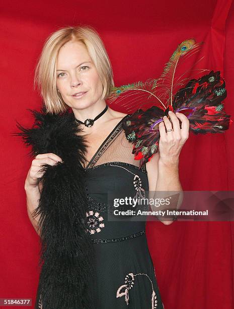 Journalist Mariella Frostrup poses in a Victorian-themed booth at the "Amnesty International - VIP Burlesque Party" at Canvas on November 25, 2004 in...