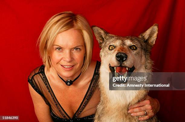 Journalist Mariella Frostrup poses in a Victorian-themed booth at the "Amnesty International - VIP Burlesque Party" at Canvas on November 25, 2004 in...