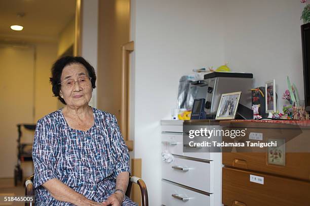 senior woman in her room - black hair dresser stock pictures, royalty-free photos & images