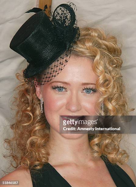 Actress Siobhan Hewlett poses in a Victorian-themed booth at the "Amnesty International - VIP Burlesque Party" at Canvas on November 25, 2004 in...