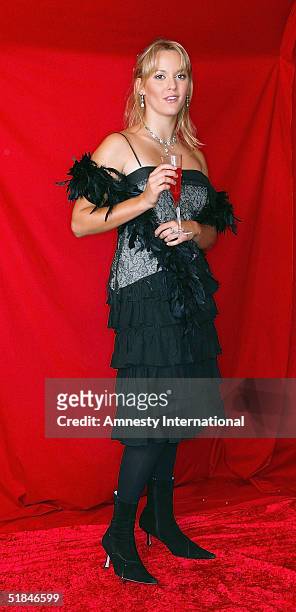 Actress Clemency Burton-Hill poses in a Victorian-themed booth at the "Amnesty International - VIP Burlesque Party" at Canvas on November 25, 2004 in...
