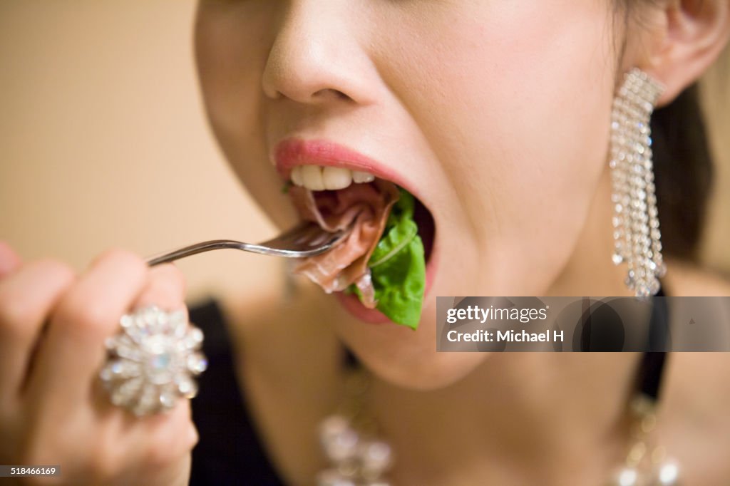 Closeup shot of young girl eating