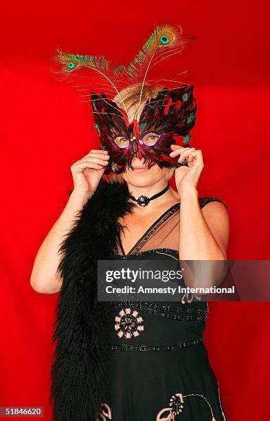 Journalist Mariella Frostrup poses in a Victorian-themed booth at the "Amnesty International - VIP Burlesque Party" at Canvas on November 25, 2004 in...