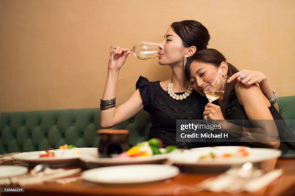 Two girls having fun in party atmosphere.