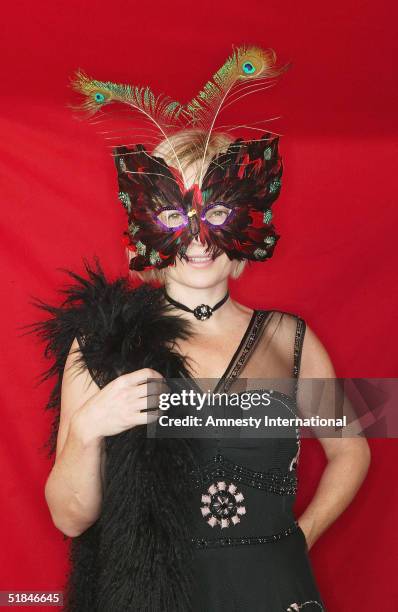 Journalist Mariella Frostrup poses in a Victorian-themed booth at the "Amnesty International - VIP Burlesque Party" at Canvas on November 25, 2004 in...