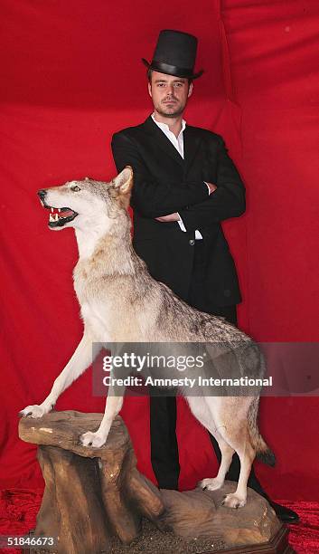 Presenter Jamie Theakston poses in a Victorian-themed booth at the "Amnesty International - VIP Burlesque Party" at Canvas on November 25, 2004 in...