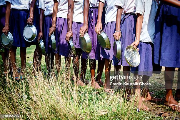 mid day meal queue - scheme stock pictures, royalty-free photos & images