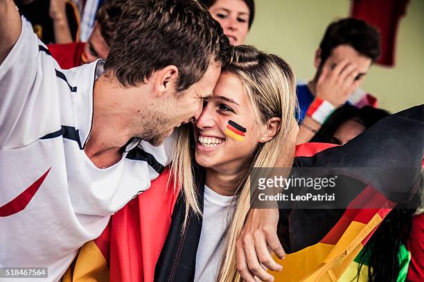 germany fans kiss - soccer germany stock pictures, royalty-free photos & images