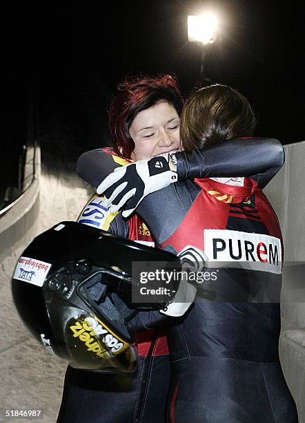 Pilot Sandra Prokoff and her brakewoman Valerie Berit Wiacker on bob Germany 1 celebrate their win at the bobsleigh World Cup competition in...