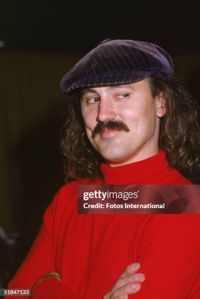 American comedian Gallagher, famous for his watermelon smashing, stands with his arms crossed as he poses outside the Shrine Auditorium before the...