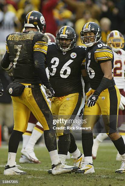 Jerome Bettis of the Pittsburgh Steelers celebrates with his teammates quarterback Ben Roethlisberger and flanker Hines Ward during the game against...