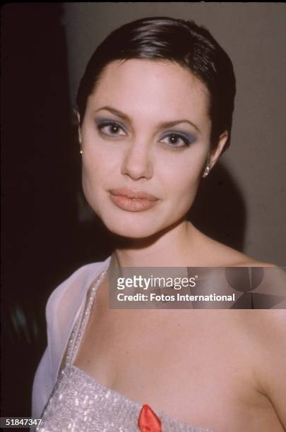 American actress Angelina Jolie at the 55th Annual Golden Globe Awards, where she won the award for Best Performance by an Actress in a Supporting...
