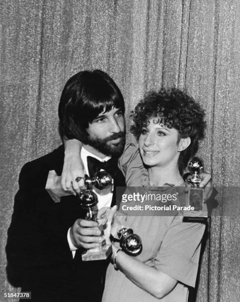 American film producer and former Hollywood hairstylist Jon Peters and American actress and singer Barbra Streisand each hold two Golden Globe awards...