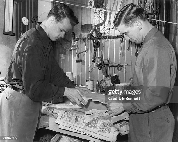 Canadian hockey legend Gordie Howe of the Detroit Red Wings works with teammate Ted Lindsay at his workshop in the basement of his home on Febuary...