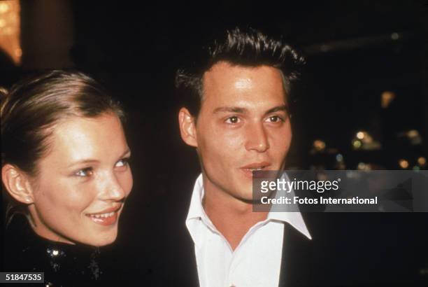 American actor Johnny Depp with his girlfriend, British model Kate Moss, at the 52nd Annual Golden Globe Awards, held at the Beverly Hilton Hotel,...