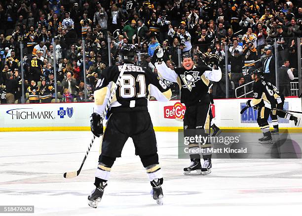Patric Hornqvist celebrates after Phil Kessel of the Pittsburgh Penguins scores the game winning goal in a shootout against the Buffalo Sabres at...