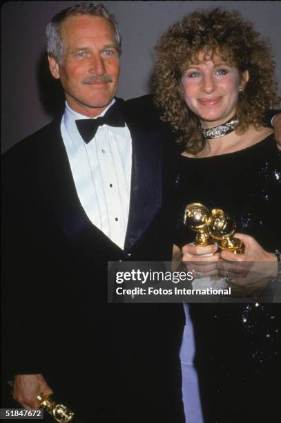 American actor Paul Newman and American singer, actress, film director and producer Barbra Streisand hold their awards at the 41st Annual Golden...