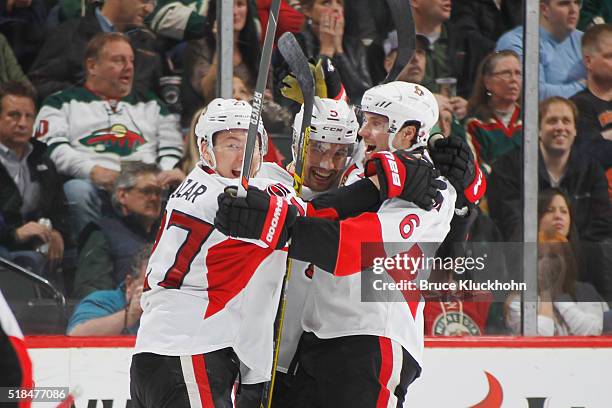 Curtis Lazar, Cody Ceci, and Bobby Ryan of the Ottawa Senators celebrate after scoring a goal against the Minnesota Wild during the game on March 31,...