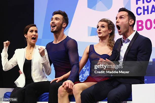 Gabriella Papadakis and Guillaume Cizeron of France celebrate their score in the Free Dance Program with their coaches Marie-France Dubreuil, left,...