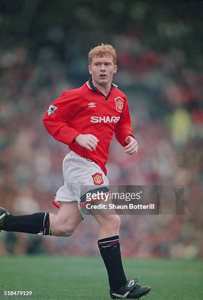 English footballer Paul Scholes playing for Manchester United against Bolton Wanderers in an English Premier League match at Old Trafford,...