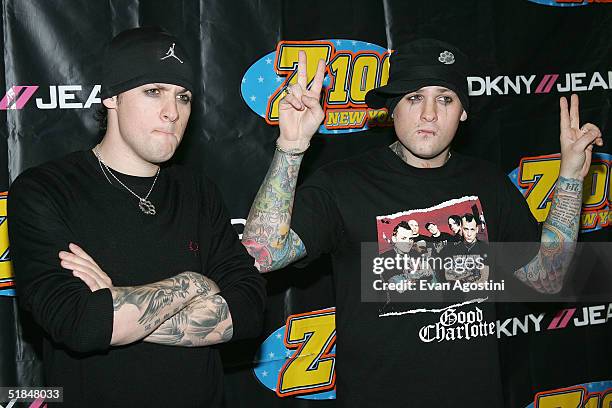 Joel Madden and Benji Madden of Good Charlotte pose backstage at the Z100 Jingle Ball 2004 at Madison Square Garden December 10, 2004 in New York...