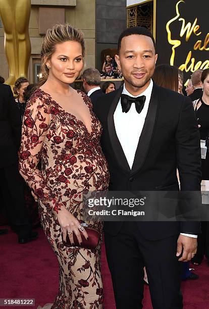 Chrissy Teigen and John Legend attend the 88th Annual Academy Awards at the Hollywood & Highland Center on February 28, 2016 in Hollywood, California.