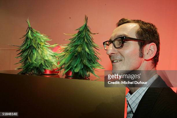 Bruno Frisoni poses with his tree at a private party featuring christmas trees created by fashion designers held at the Centre Pompidou December 10,...
