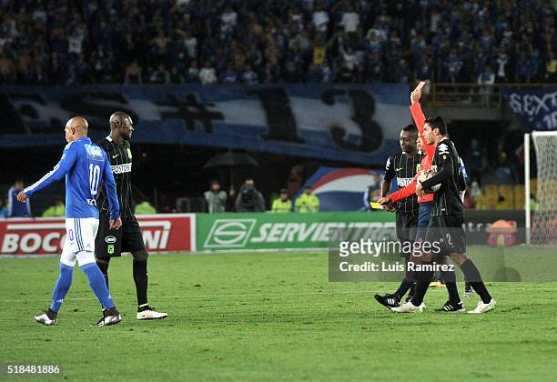 Luis Sanchez referee shows red card to Victor Ibarbo player of Atletico Nacional, during a match between Millonarios and Atletico Nacional as part of...