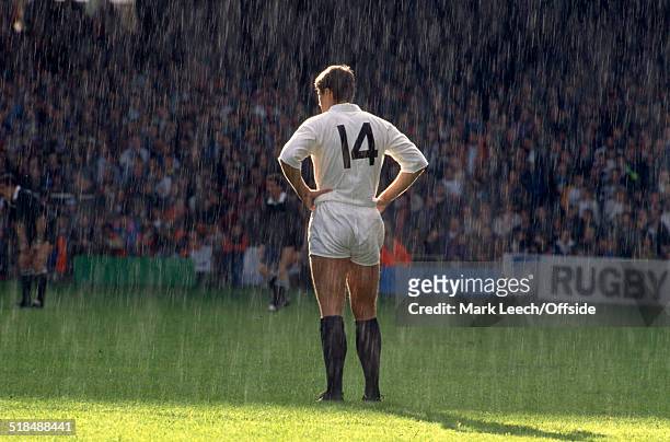 October 1991 - Rugby World Cup - New Zealand v Scotland - Tony Stanger of Scotland stands on the pitch with the rain pouring down as he stands in the...