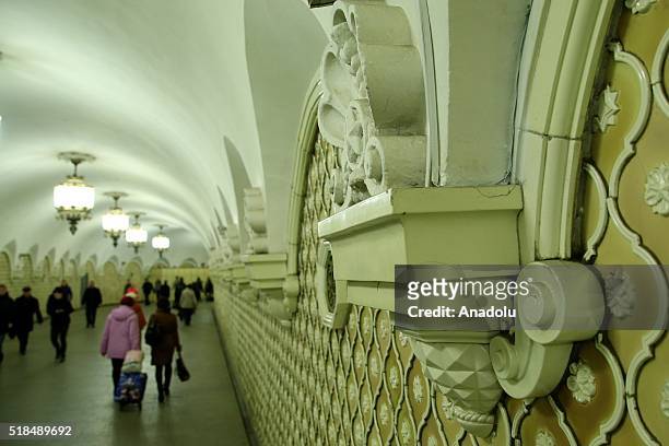 Passengers are seen walking past in front of the wall reliefs at the Komsomolskaya Metro Station in Moscow, Russia on April 01, 2016. The Moscow...