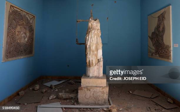 Beheaded and mutilated statue is seen in the destroyed museum in the ancient Syrian city of Palmyra on March 31, 2016. Syrian troops backed by...