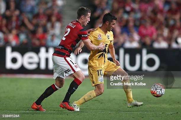 Scott Neville of the Wanderers and Luis Garcia of the Mariners compete for the ball during the round 26 A-League match between the Western Sydney...