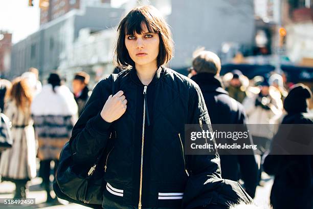 American model Lily Stewart exits the Public School in a thin blue patchwork bomber jacket during New York Fashion Week: Women's Fall/Winter 2016 on...