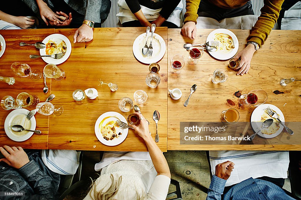 Overhead view of friends at table during party