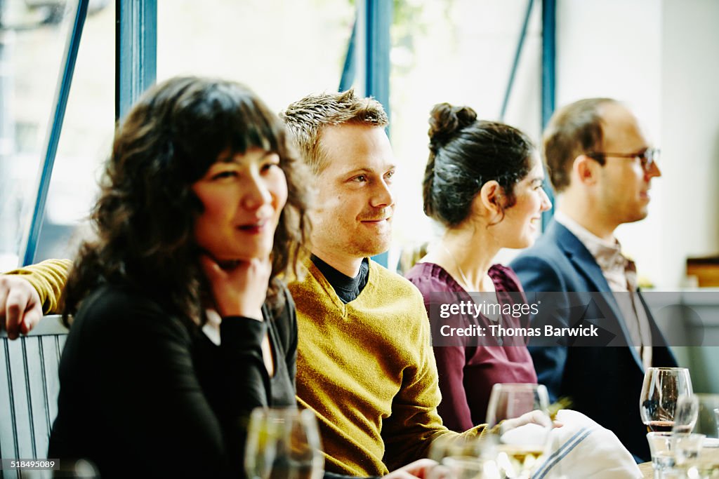 Couple dining together with friends in restaurant