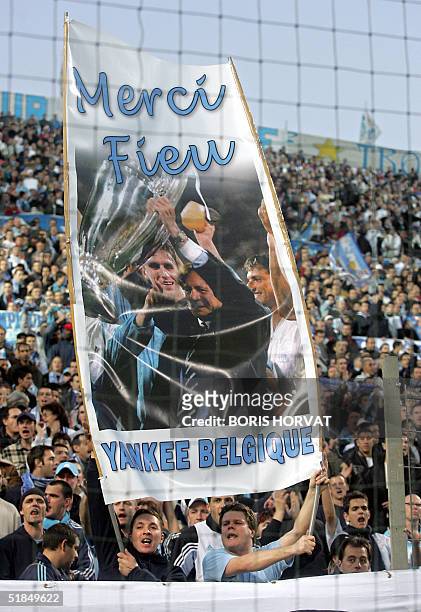 Marseille's fans hold a banner in tribute to Marseille's former Belgian coach Raymond Goethals during the French first league football match between...