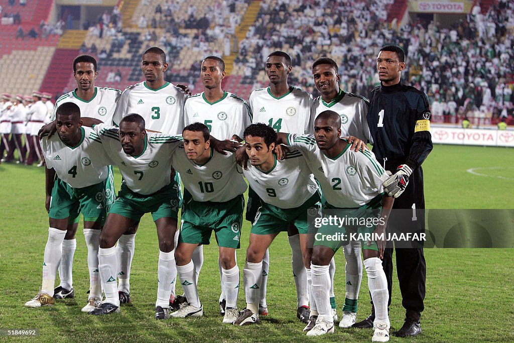 Saudi players pose for a picture before