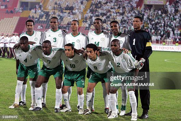 Saudi players pose for a picture before the start of their match against Kuwait at the 17th Arabian Gulf Cup,11 December 2004 in Doha. AFP...