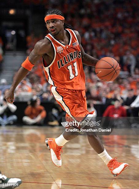 Dee Brown of Illinois brings the ball upcourt during a game against Oregon on December 11, 2004 at the United Center in Chicago, Illinois. Illinois...