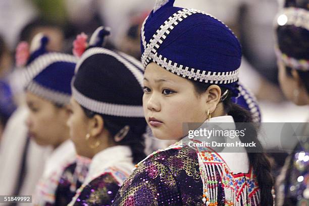 Young woman wears a traditional Hmong outfit at the Hmong New Year Celebration at the Wisconsin State Fair December 11, 2004 in West Allis, Wisconsin.