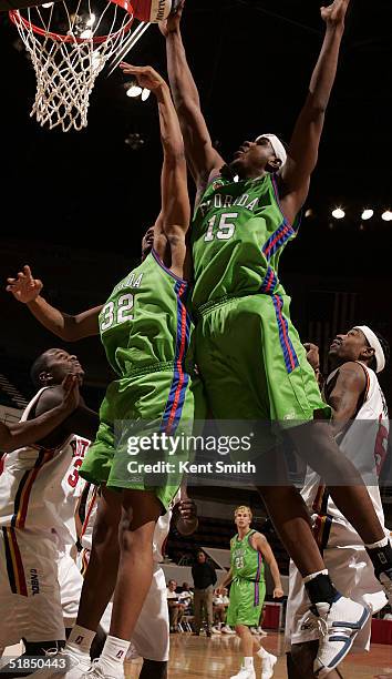 Marcus Moore and Hiram Fuller of the Florida Flame battle for the rebound against the Huntsville Flight on December 11, 2004 at the Von Braun Center...