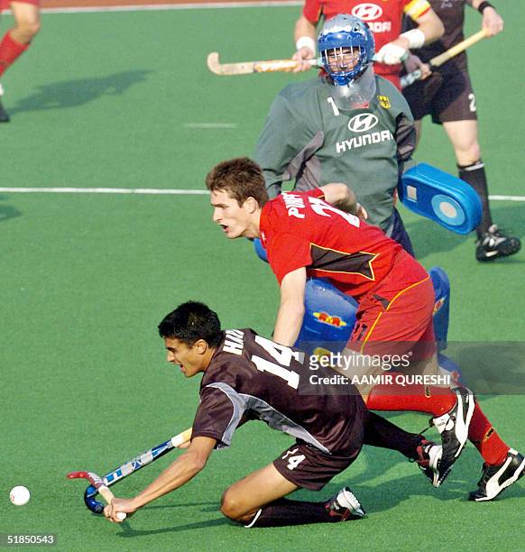 New Zealand's field hockey player Hari Bevan and Germany's Purps Michael fight for the ball during their men's Champions Trophy field hockey...