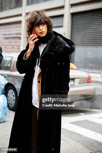 Argentinian model Mica Arganaraz makes a phone call after the Tommy Hilfiger show at Park Avenue Armory during New York Fashion Week: Women's...