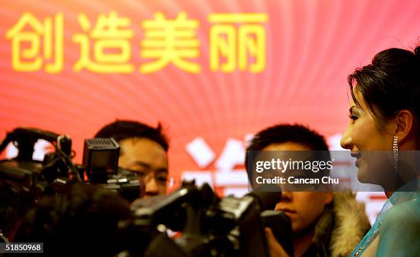 Liu Xiaojing, a 22 year-old transsexual, attends a news conference promoting the first Miss Plastic Surgery Contest on December 12, 2004 in Beijing,...