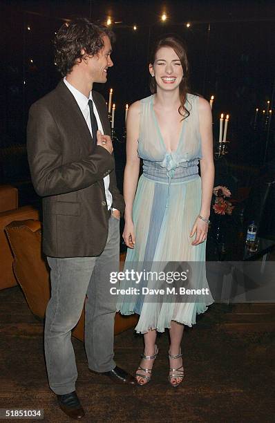 Actors Hugh Dancy and Anne Hathaway attend the 'Ella Enchanted' movie afterparty at the Rouge club on December 11, 2004 in London.