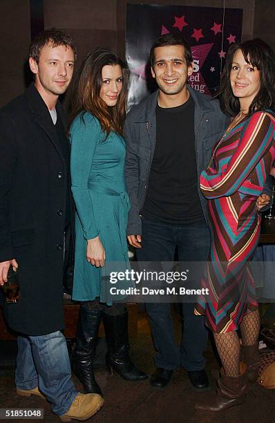 Actors John Simm, Kate Magowan, Jimmy Mistry and Meg Mistry attend the 'Ella Enchanted' movie afterparty at the Rouge club on December 11, 2004 in...