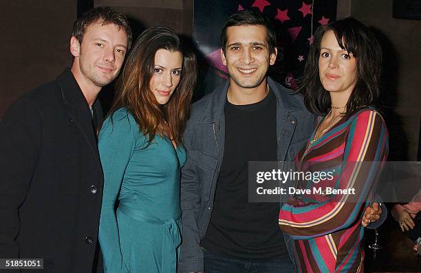 Actors John Simm, Kate Magowan, Jimmy Mistry and Meg Mistry attend the 'Ella Enchanted' movie afterparty at the Rouge club on December 11, 2004 in...