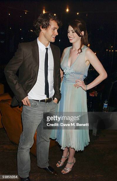 Actors Hugh Dancy and Anne Hathaway attend the 'Ella Enchanted' movie afterparty at the Rouge club on December 11, 2004 in London.