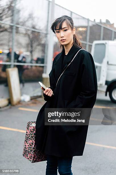 Chinese model Dylan Xue wears a black coat after the Coach show during New York Fashion Week: Women's Fall/Winter 2016 on February 16, 2016 in New...