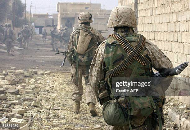 Marines patrol the restive city of Fallujah, 50 kms west of Baghdad, 12 December 2004. Marines were continuing their hunt for rebels in Fallujah,...